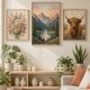 Three framed paint by numbers on a gallery wall Mountain, floral and highland cow paint by numbers canvases on a cream wall