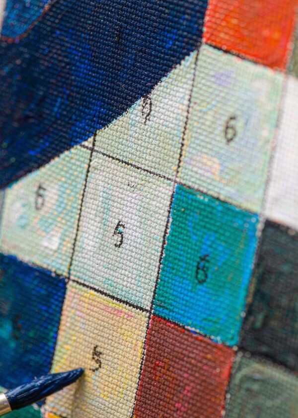 Painted canvas detail close up Close up of a half painted canvas showing numbered sections and brush strokes